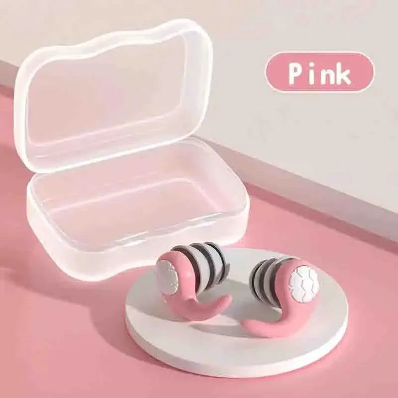 Soft silicone sleep earplugs in a clear travel case on a pink background