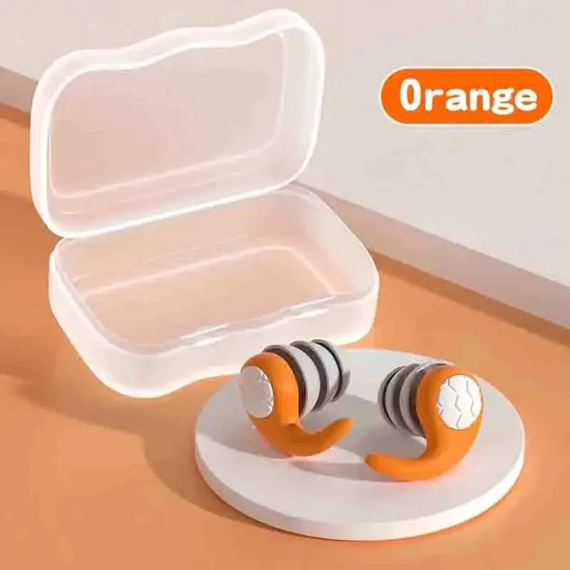 Soft silicone sleep earplugs in a clear travel case on an orange background